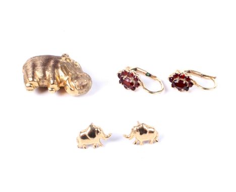 A vintage 9ct hollow gold 'hippo' pendant and two pairs of earrings. The first with hallmarks for London 1977, 1.8 grams. The