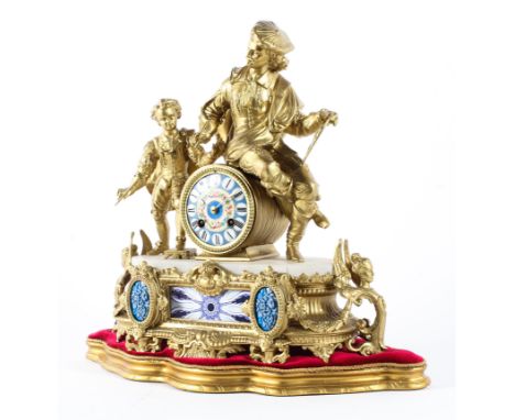 A French gilt-metal and porcelain mounted eight day striking mantel clock. Surmounted with a figural gilt metal artist and bo