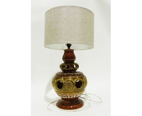 Pottery table lamp of baluster form with pierced and floral decoration in green and brown&nbsp;