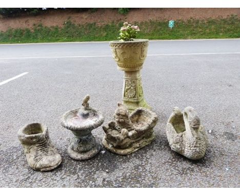 Stone-effect garden swan planter, 37cm wide, a small bird bath, 29cm diameter, a reproduction staddlestone, a gnome-shaped pl