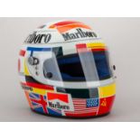 A Gerhard Berger Bieffe replica helmet with sponsors logos