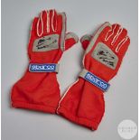 Pair of Mika Salo race used autographed Sparco gloves.