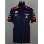 Red Bull racing 2019 replica polo shirt signed by Max Verstappen and Alex Albon.