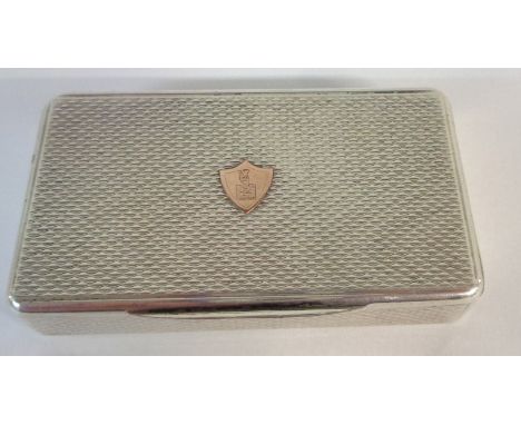 A continental white metal snuff box with engine turned decoration, initials to yellow metal shield shaped cartouche and gilt 
