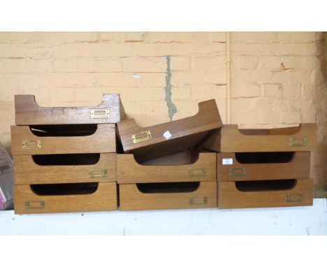 Ten matching vintage mixed wood file drawers with brass name slides