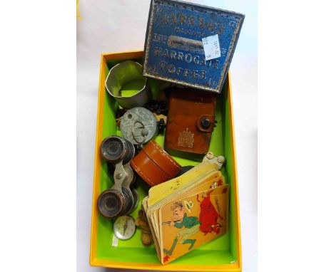 A box containing a quantity of assorted collectable items including vintage ceramic cake decorations, novelty compasses, leat