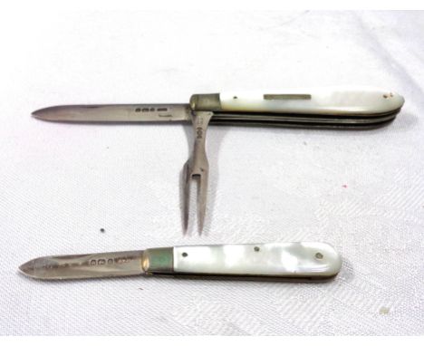 A silver bladed combined fruit knife and fork - sold with a smaller silver bladed folding fruit knife, both with mother-of-pe