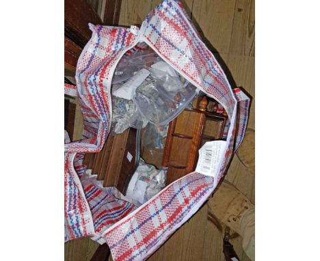 A bag containing a large quantity of collectable ceramic and other thimbles and wooden display cases