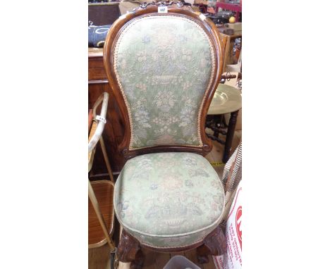 A late Victorian mahogany part show frame spoon back drawing room chair with floral tapestry upholstery, set on ornate carved