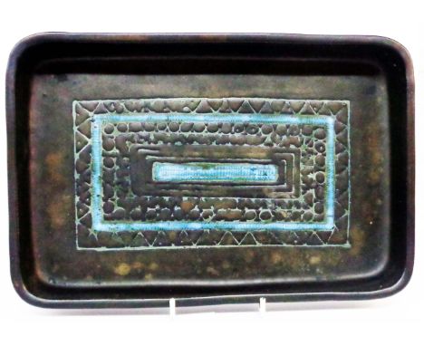 A 1960's Troika St. Ives serving dish with central textured panel and blue enamel highlighting on a black glaze ground - pain