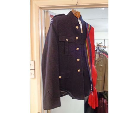 A vintage Royal Marines dress uniform comprising jacket with gilt buttons, trousers, belt, cap and sash