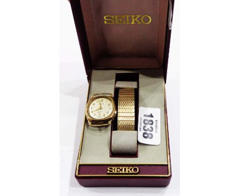A vintage Avia 9ct. gold cased cushion shaped wristwatch a/f, plated strap and Seiko box