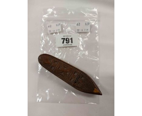 A small treen shoe form snuff box with hinged lid, chip carved decoration and inlaid heart motif