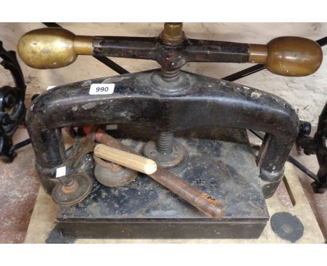 An antique table book press with black japanned finish and brass handle finial - sold with four old bookbinding tools