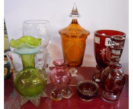 A small quantity of assorted coloured glassware including Bohemian amber flash cut cup and cover, similar ruby flash cut gobl