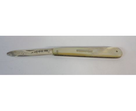 A silver bladed fruit knife with mother-of-pearl clad handle and blank cartouche