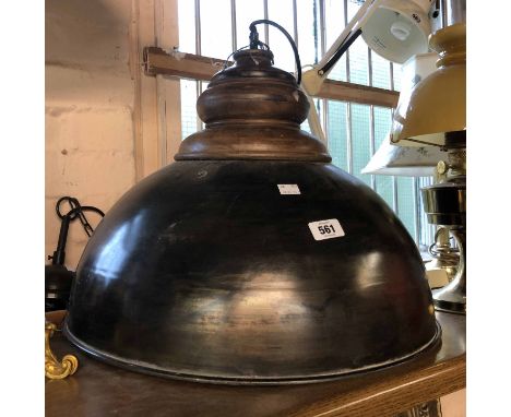 A large industrial style hanging ceiling lamp with metal dome and wooden fitting