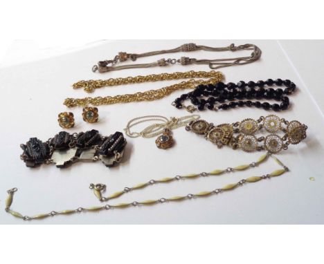 A small quantity of vintage white metal and other jewellery including watch chain and jet style bracelet, etc.