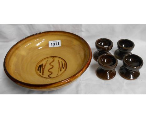 A Winchcombe Pottery bowl decorated by Sidney Tustin with brushwork on a slip ground - impressed Winchcombe and S.T. mark - s
