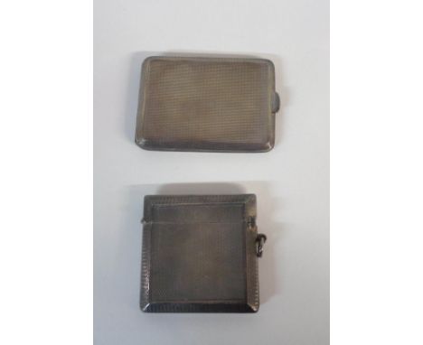 A silver vesta case - sold with a silver matchbook holder, both with engine turned decoration