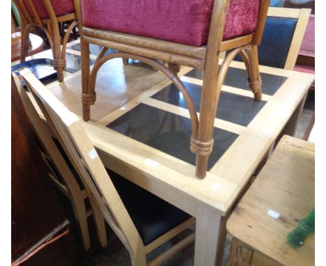 A 1.5m modern mixed wood dining table with flanking inset granite panels to top, set on square legs - sold with a set of six 