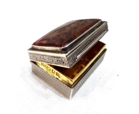 A silver snuff box with hardstone inset hinged lid and gilt interior