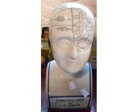 A modern ceramic phrenology head with crackle glaze finish