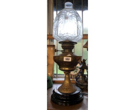 A late 19th Century brass oil lamp with Art Nouveau moulding to pedestal, glass chimney and frosted and etched glass shade, s