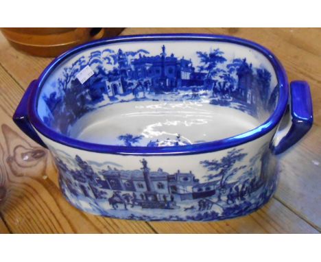 A small modern blue and white china planter of footbath form
