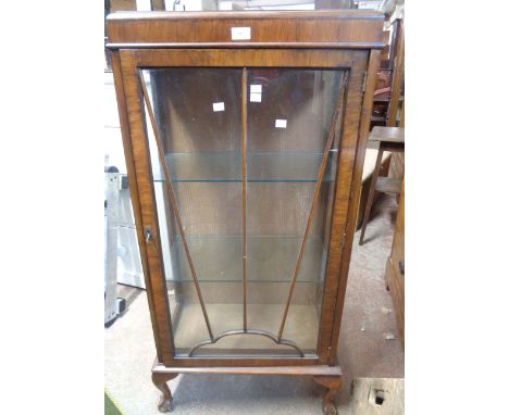 A 58cm 1930's walnut display cabinet with glass shelves enclosed by a sunray beaded glazed panel door