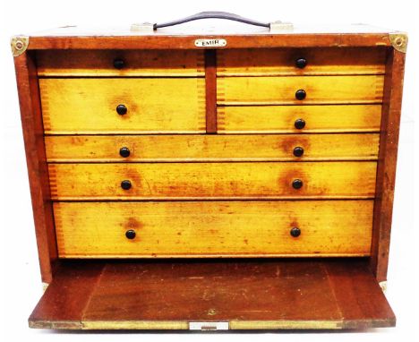 A 46cm vintage mixed wood engineer's tool chest with and array of graduated drawers enclosed by a locking slide - bearing Emi