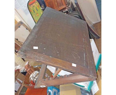 An old wooden table-top drawing board with ratchet action