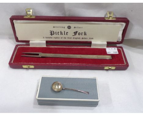 A boxed silver pickle fork and a mustard spoon