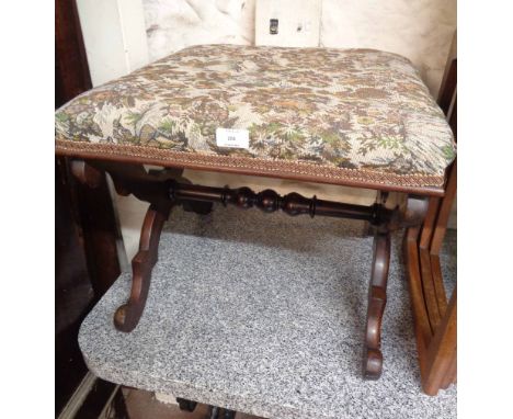 A late Victorian stained walnut X-frame dressing stool with later tapestry upholstery, set on scroll supports and turned stre
