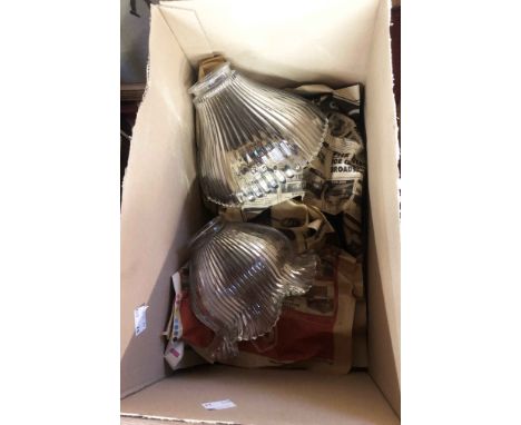 A box containing two moulded holophane style clear glass lampshades - sold with an Edwardian frosted glass oil lamp shade