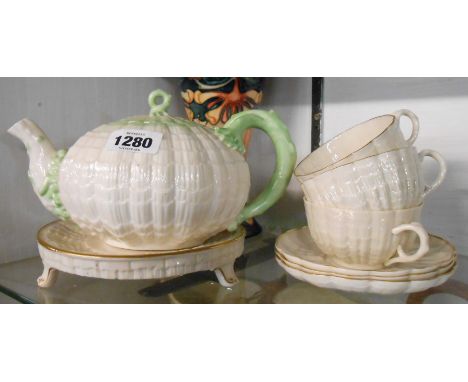 A quantity of Belleek porcelain comprising Second Period teapot of typical shell moulded globe form with applied coral form h