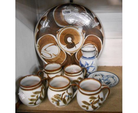 A quantity of Aldermaston studio pottery comprising five Alan Caiger-Smith mugs, a small bowl, vase and large round platter