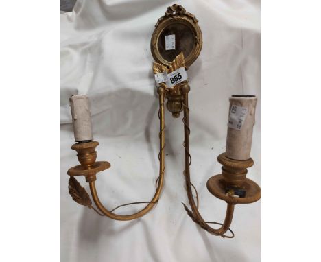 An Italian gilt metal twin branch electric light sconce with central mirror panel