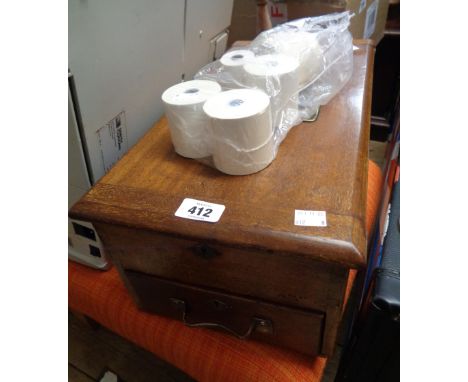 An old mahogany shop till with brass framed glass panel to top, bell action and drawer, also a quantity of receipt rolls