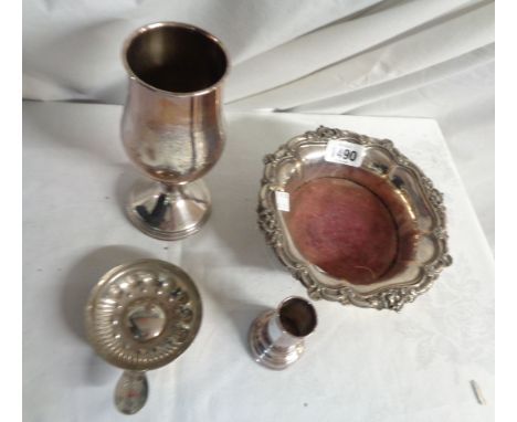 A silver plated wine coaster, goblet and candlestick