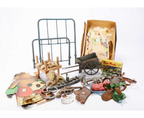 Various toys,  a toy trumpet, accessories from fancy dress outfits, a cast-iron dolls' bed head and foot, a tinplate cart, tw