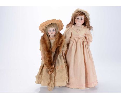 An Armand Marseille 1894 child doll,  with head turned slightly to the right, fixed brown eyes, brown mohair wig, gusseted ki