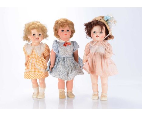 Three post-war hard plastic dolls,  comprising of two 1950s Pedigree Walkers, possibly Saucy Walker dolls, with blue sleeping