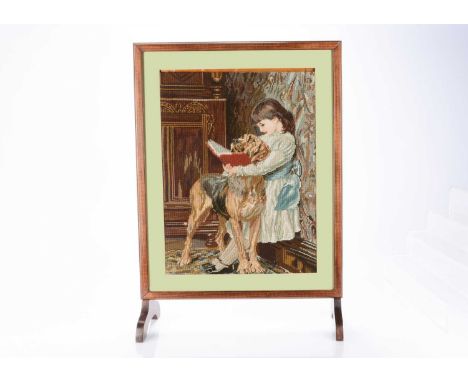 A Peerart fire screen  with needlework of the Victorian painting a Compulsory Education by Charles Barton —29 ¾in. (76cm.) hi