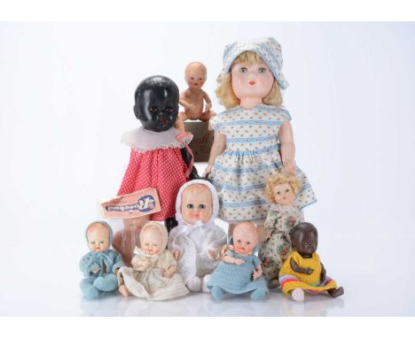 Ten Rosebud hard plastic dolls, including a 1950s girl doll with blonde mohair, blue sleeping eyes, knee jointed with white a