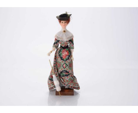 An Ann Parker artist doll modelled after an Edwardian Lady, cast polyester resin, with wired arms, on original base, with par