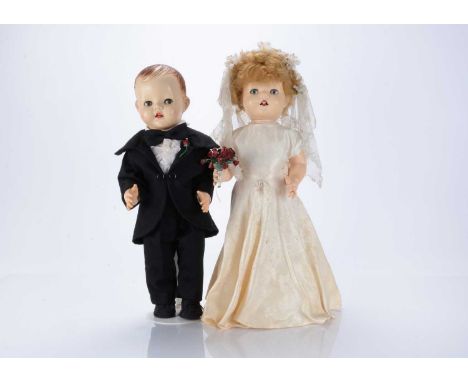 Two hard plastic dolls dressed as Bride and Groom,  bride from the Saucy Walker range, with blue sleeping flirty eyes, fair n