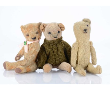 Three small teddy bears, a British 1920s blonde mohair bear, with clear and black glass eye with orange painted back (missing
