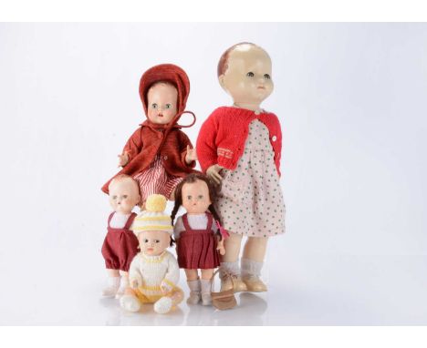 Five 1950s Pedigree hard plastic dolls, including a boy and girl doll in matching outfits, with blue sleeping eyes, a small b