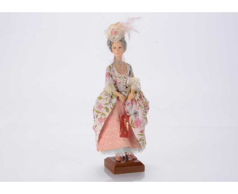 An Ann Parker artist doll modelled after a lady in English costume of 1775, cast polyester resin, with wired arms, floral dre